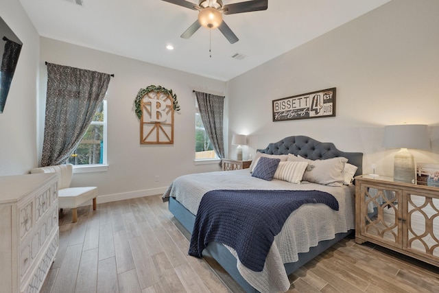 bedroom with hardwood / wood-style floors and ceiling fan