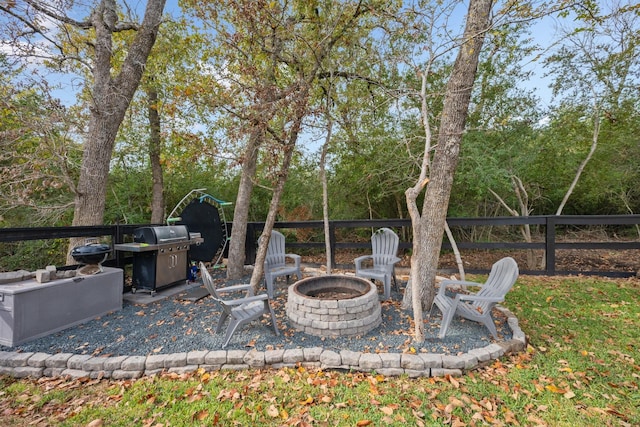 view of patio with grilling area and an outdoor fire pit