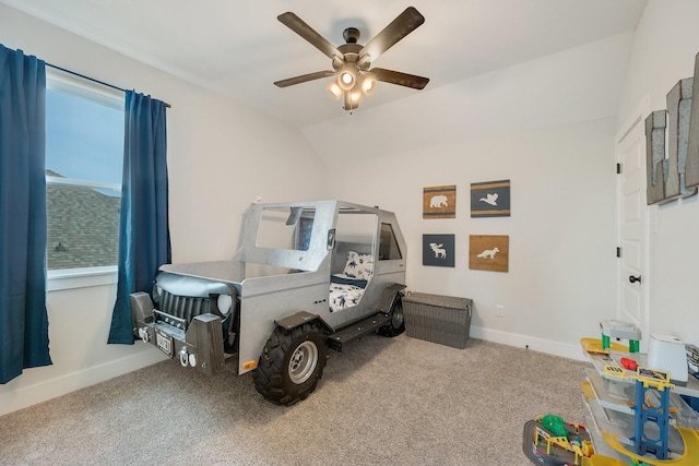 bedroom featuring carpet flooring, vaulted ceiling, and ceiling fan