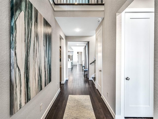 corridor with dark wood-type flooring