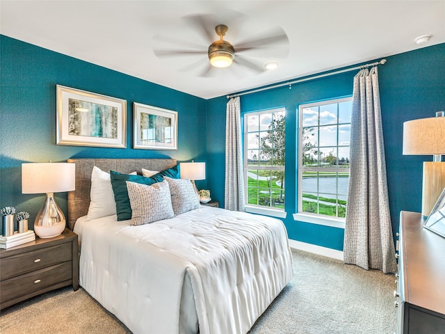 carpeted bedroom featuring ceiling fan