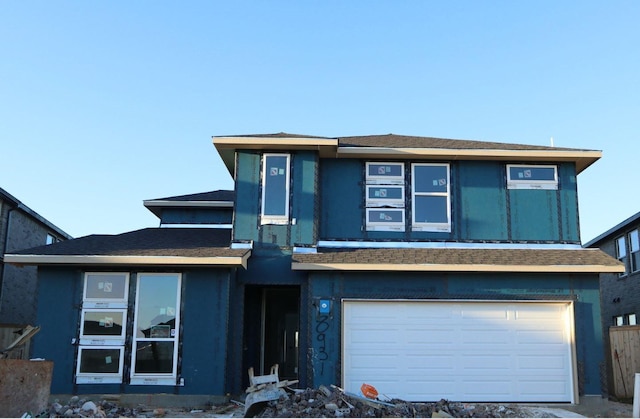 prairie-style home with a garage