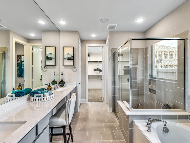 bathroom featuring vanity and shower with separate bathtub