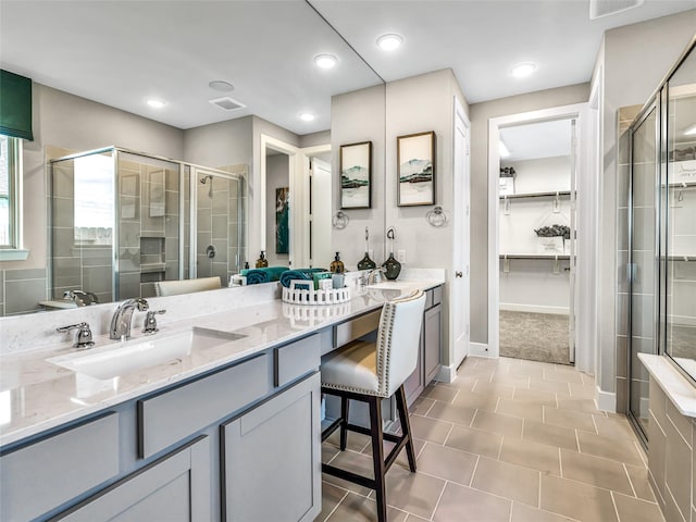 bathroom with vanity and walk in shower