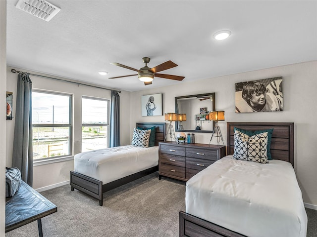 bedroom featuring ceiling fan and carpet floors