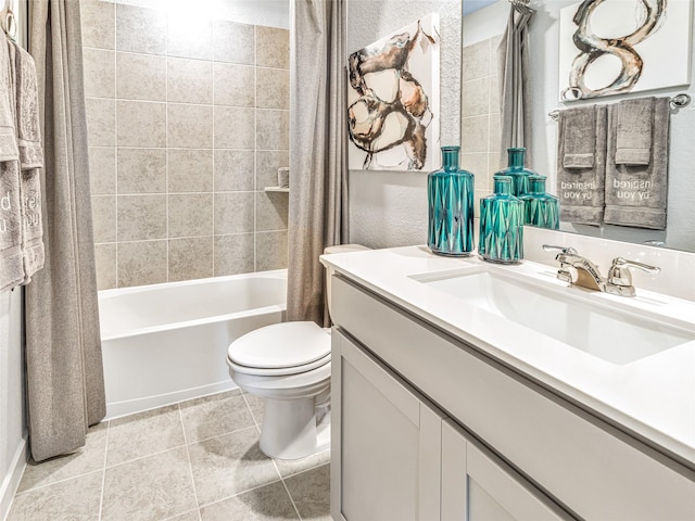 full bathroom with tile patterned floors, shower / bath combo with shower curtain, vanity, and toilet