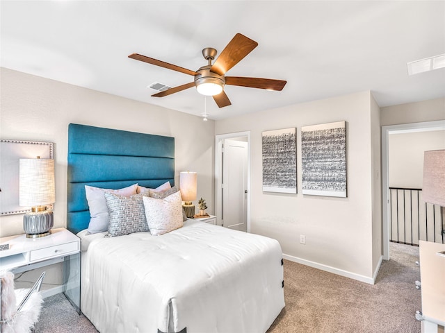 bedroom featuring light colored carpet and ceiling fan