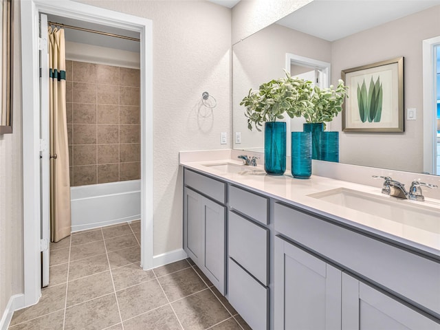 bathroom with shower / bathtub combination with curtain, tile patterned flooring, and vanity