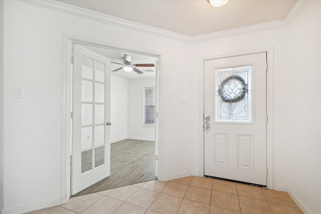 entryway with ceiling fan, light wood-type flooring, and ornamental molding