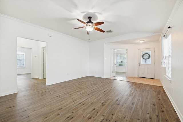 entryway featuring hardwood / wood-style floors, ceiling fan, and ornamental molding