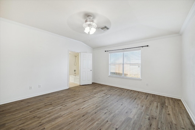 unfurnished room featuring hardwood / wood-style flooring, vaulted ceiling, ceiling fan, and crown molding