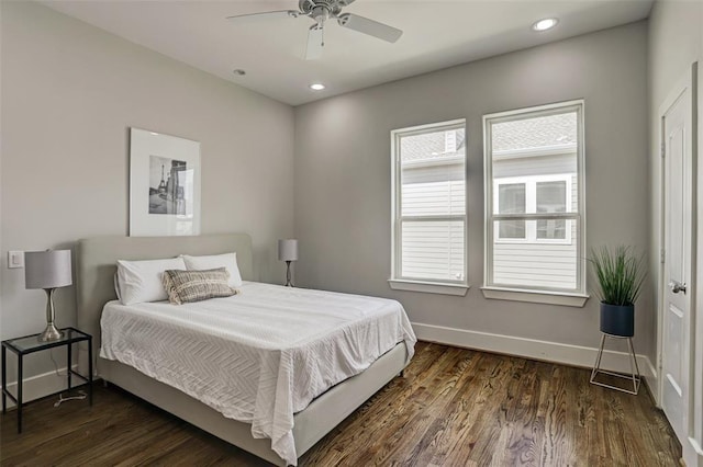 bedroom featuring ceiling fan and dark hardwood / wood-style flooring