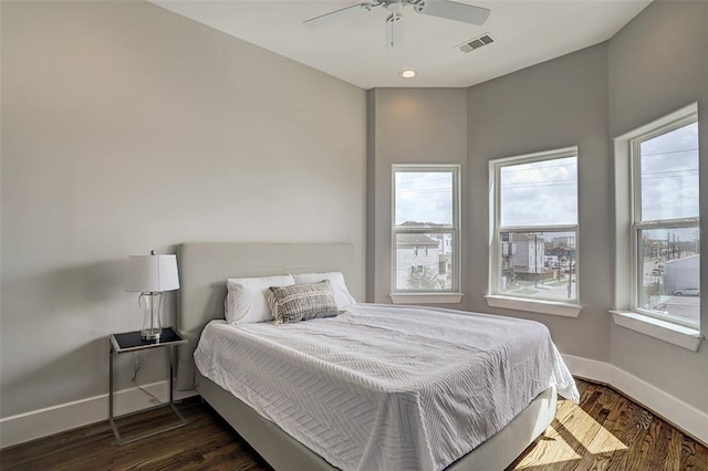 bedroom featuring ceiling fan and dark hardwood / wood-style floors