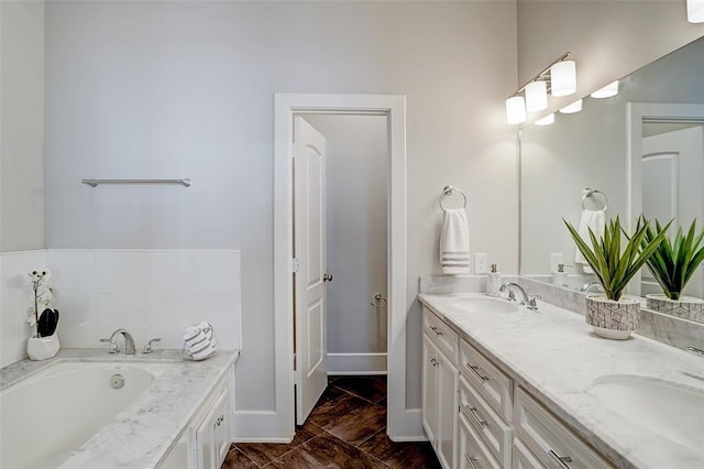 bathroom featuring a bath and vanity