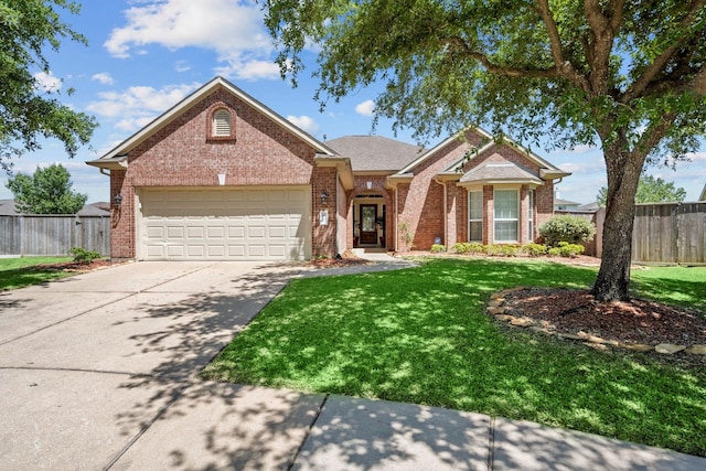 view of front of home featuring a front lawn and a garage