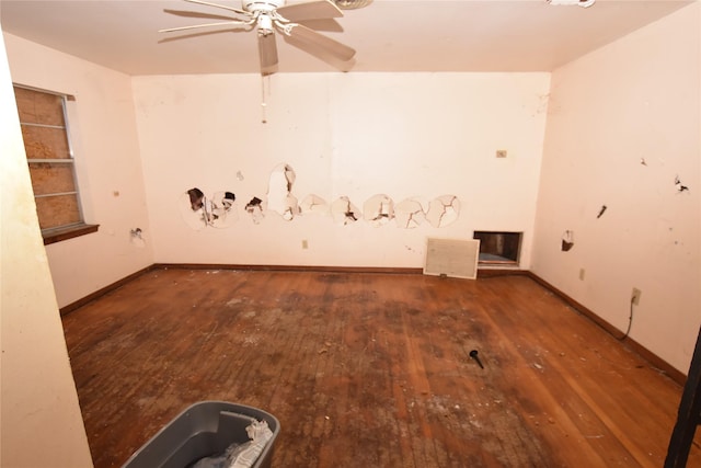 spare room featuring dark hardwood / wood-style flooring and ceiling fan