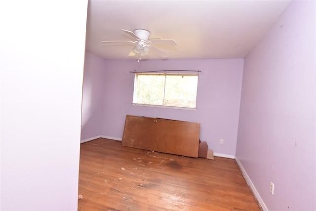 empty room featuring ceiling fan and wood-type flooring