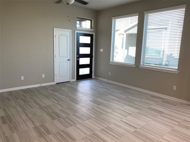 entrance foyer with ceiling fan