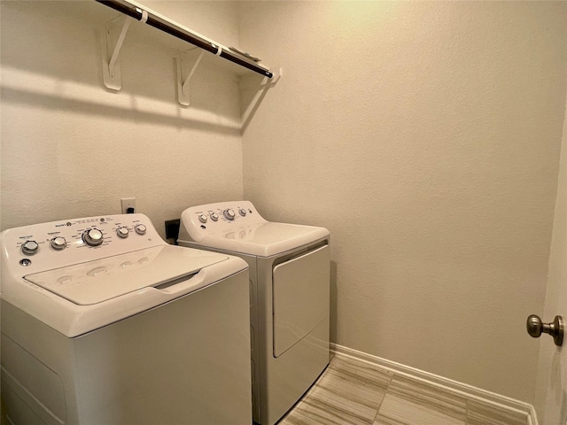 washroom featuring washer and dryer