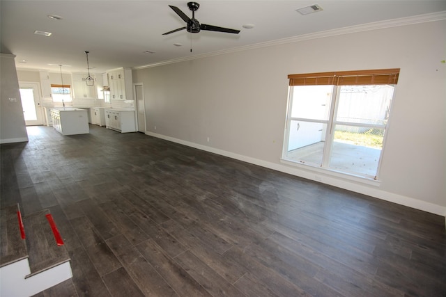 unfurnished living room with dark hardwood / wood-style flooring, ceiling fan, crown molding, and sink