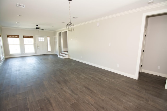 unfurnished living room featuring ceiling fan, crown molding, and dark wood-type flooring