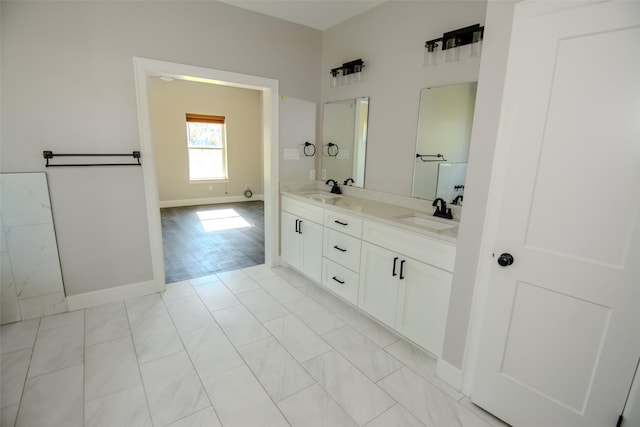 bathroom with hardwood / wood-style floors and vanity