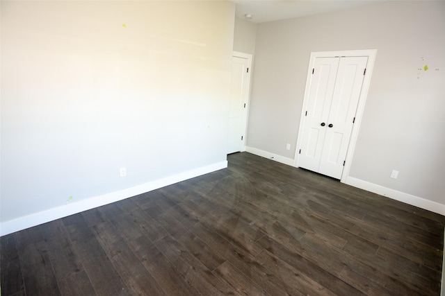 spare room featuring dark hardwood / wood-style flooring