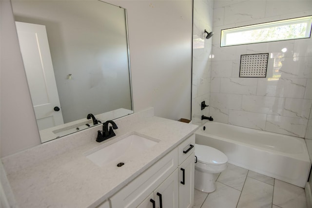 full bathroom with vanity, tiled shower / bath combo, and toilet