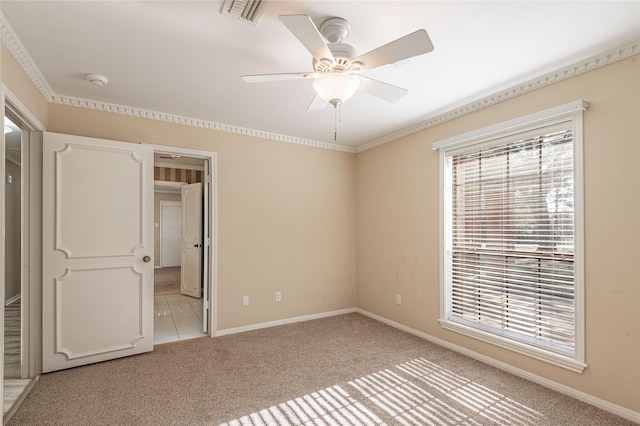 unfurnished bedroom featuring light carpet and ceiling fan