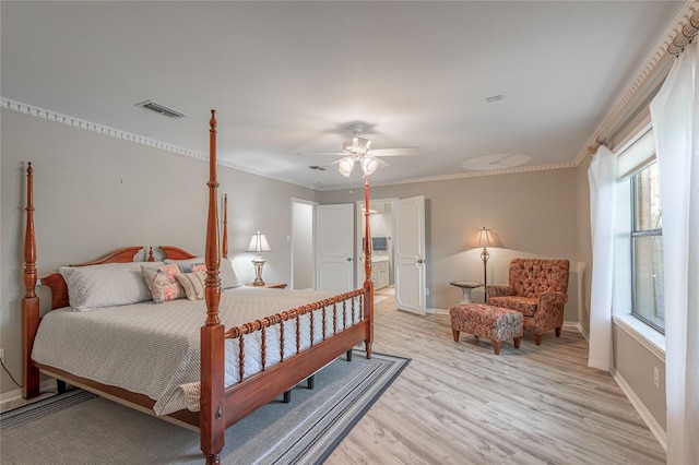 bedroom with light hardwood / wood-style flooring, ceiling fan, and crown molding