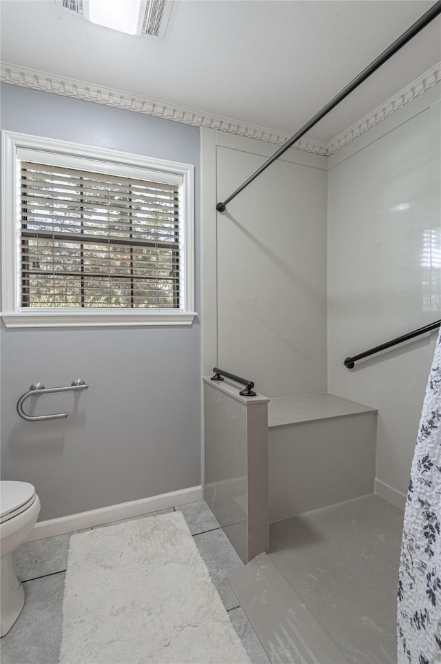 bathroom with toilet and concrete floors