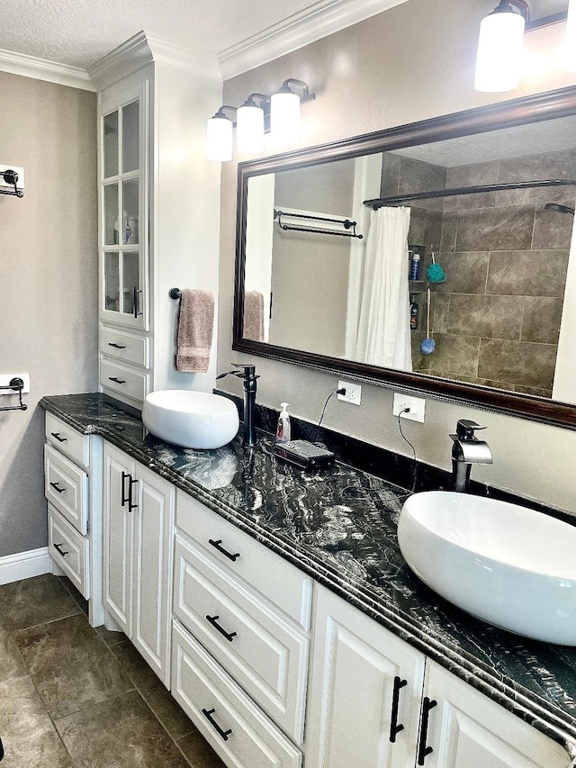 bathroom featuring a shower with curtain, vanity, a textured ceiling, crown molding, and tile patterned flooring