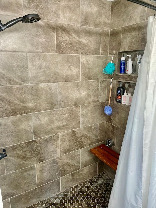 bathroom featuring a shower with curtain