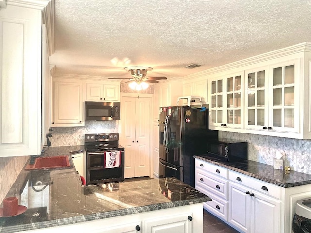 kitchen with black appliances, white cabinets, ceiling fan, a textured ceiling, and kitchen peninsula