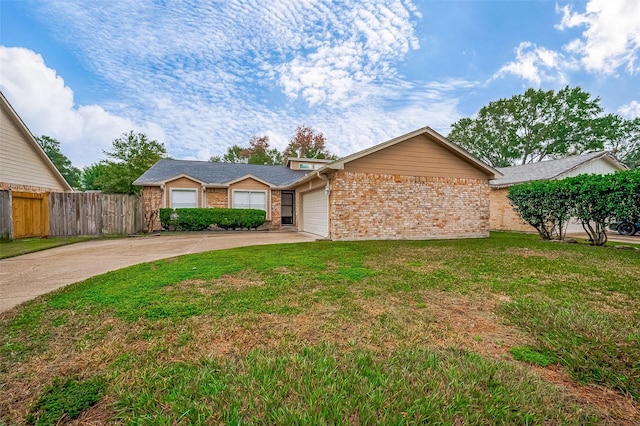 single story home featuring a garage and a front yard