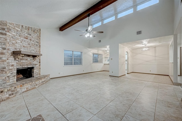 unfurnished living room featuring beamed ceiling, ceiling fan, high vaulted ceiling, and a brick fireplace