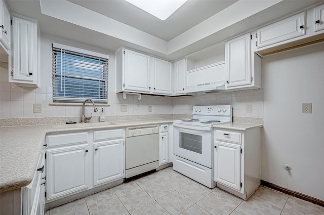 kitchen featuring white cabinets, light tile patterned floors, white appliances, and range hood