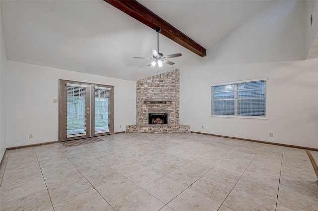 unfurnished living room with french doors, a fireplace, ceiling fan, beamed ceiling, and light tile patterned flooring