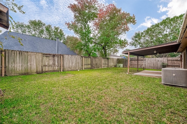 view of yard with a patio and central AC