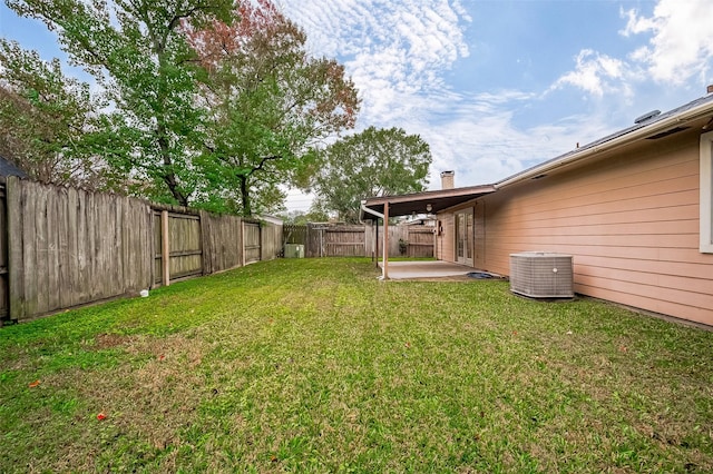 view of yard with a patio and central AC