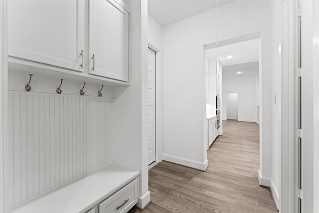 mudroom with light wood-type flooring