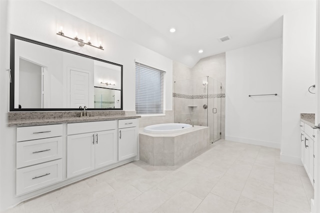 bathroom with tile patterned floors, vanity, and independent shower and bath