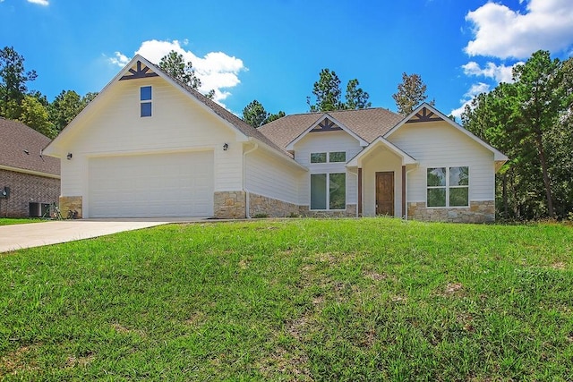 view of front of house featuring central AC unit, a front yard, and a garage