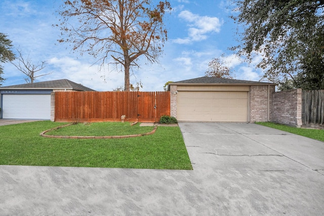 view of front of house with a front yard and a garage