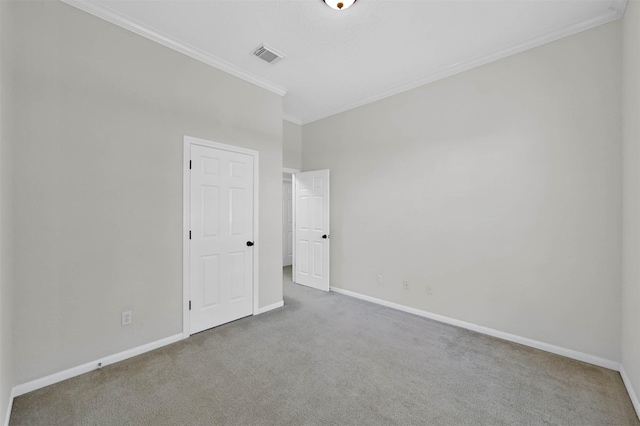 unfurnished room featuring carpet and ornamental molding