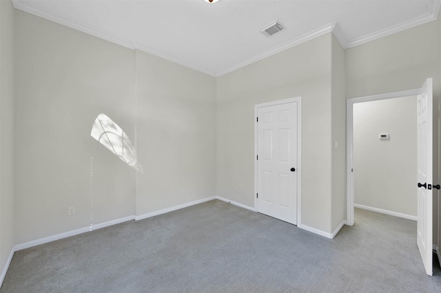 carpeted empty room with crown molding