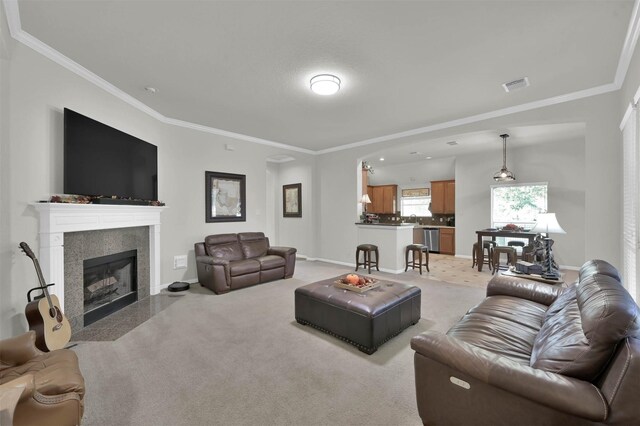 living room with crown molding, a fireplace, light colored carpet, and sink