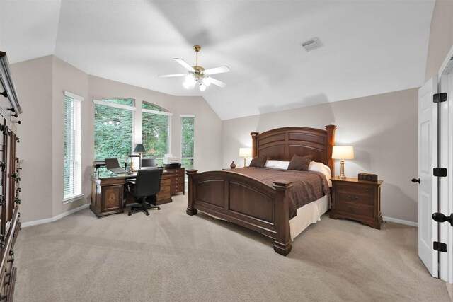 carpeted bedroom featuring multiple windows, ceiling fan, and lofted ceiling