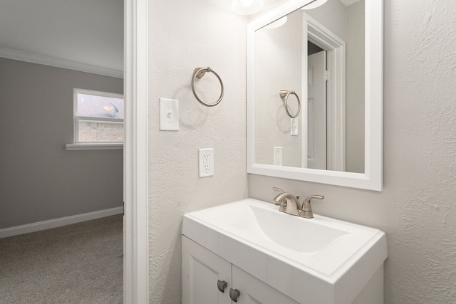 bathroom featuring vanity and crown molding