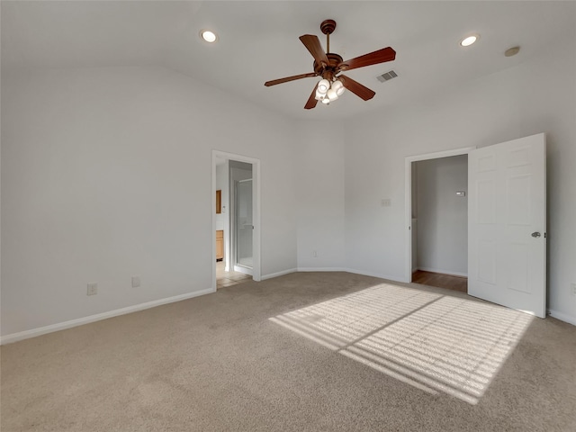 unfurnished bedroom with light colored carpet, ceiling fan, and lofted ceiling